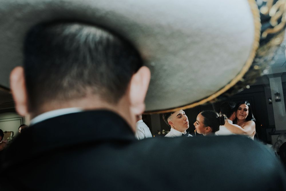 Artistic portrait of couple from mariachi hat pop
